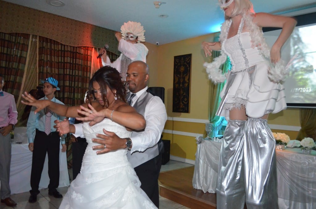 Bride And Groom Dancing Next To Stilt Entertainers | Miami's Best Hora Loca Entertainment For Your Party | Blogs