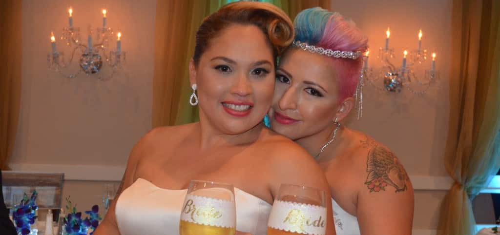 Michelle and Astrid pose at their gay friendly wedding