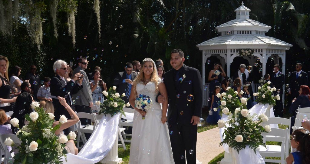 stephanie and manny at wedding ceremony in isle