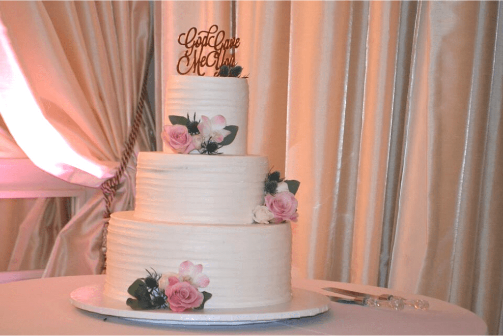 A wedding cake decorated with flowers