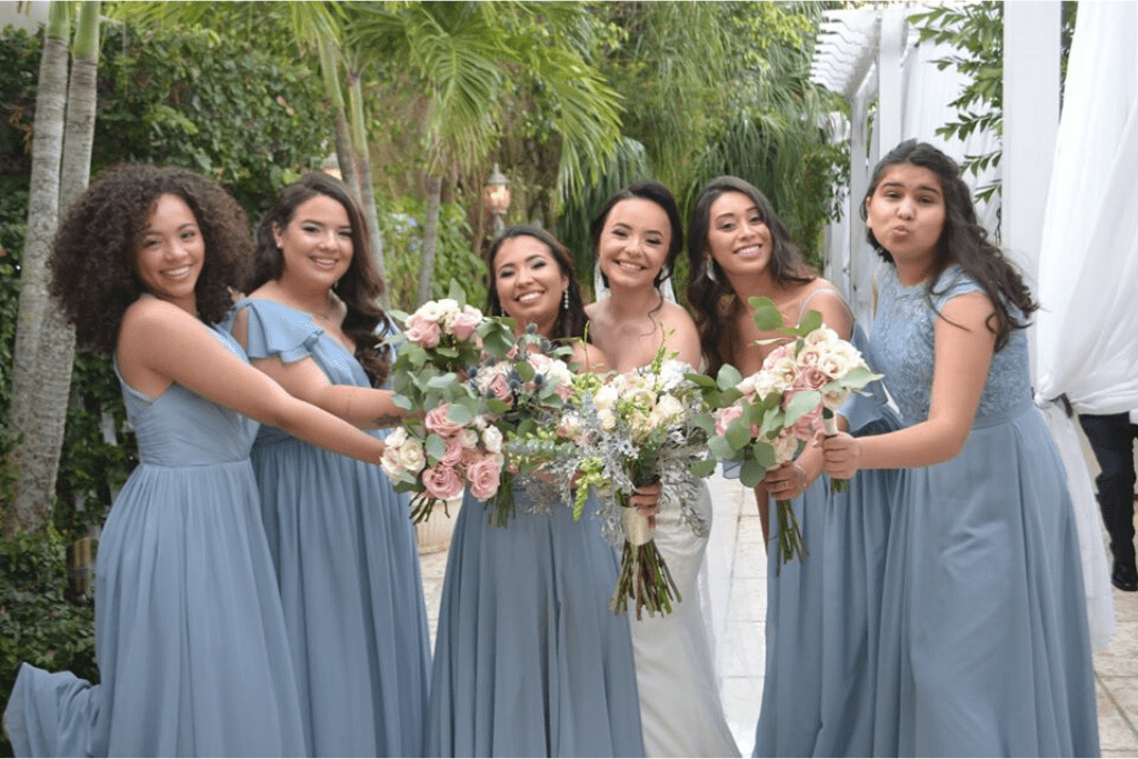 Bridesmaids smiling for the camera
