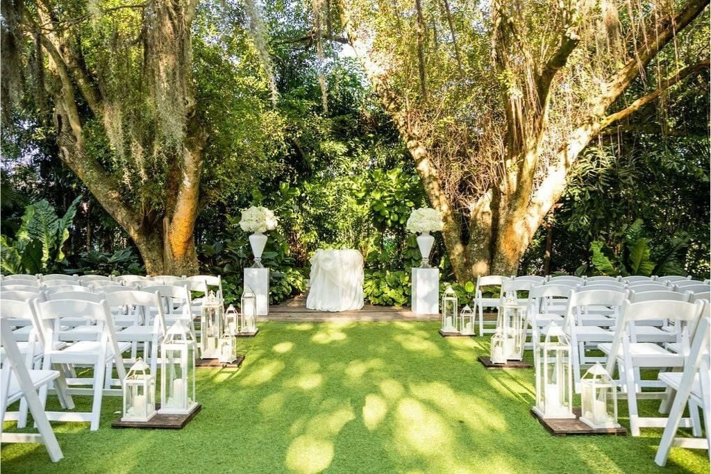 An outdoor wedding venue around trees