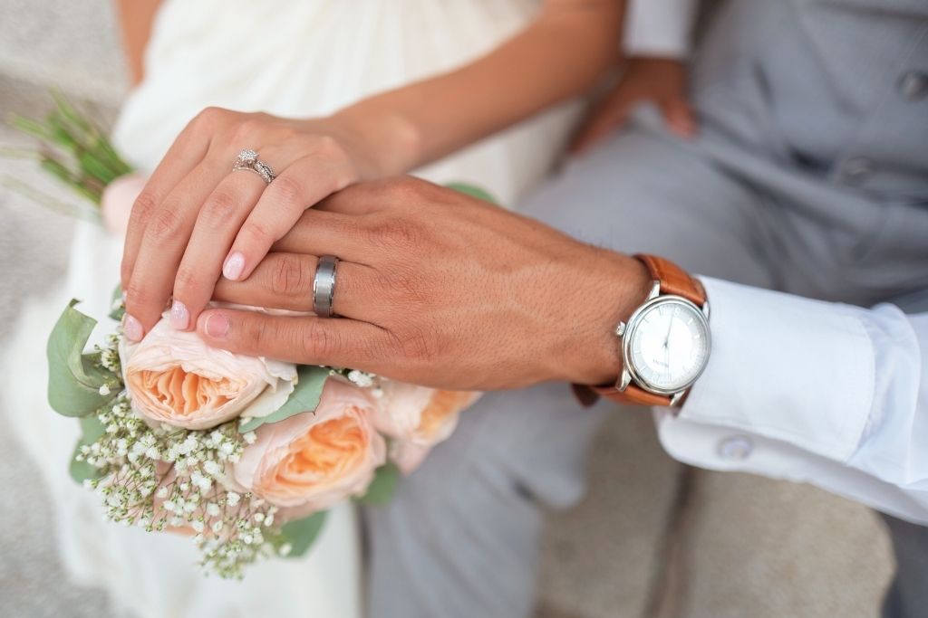 The wedding rings of a couple in love