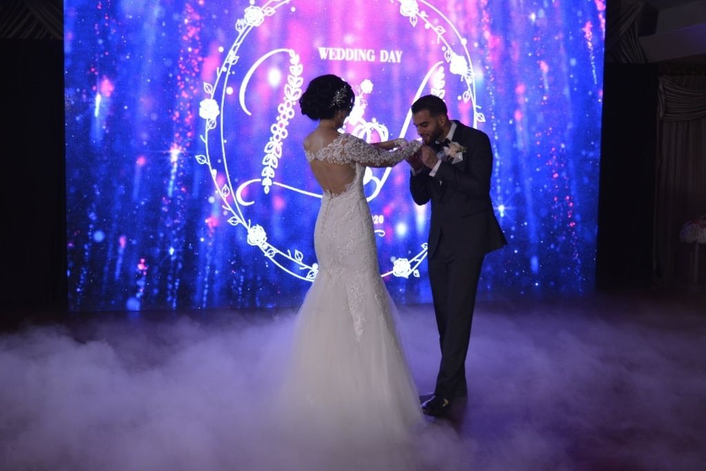 A bride and groom dancing on their wedding