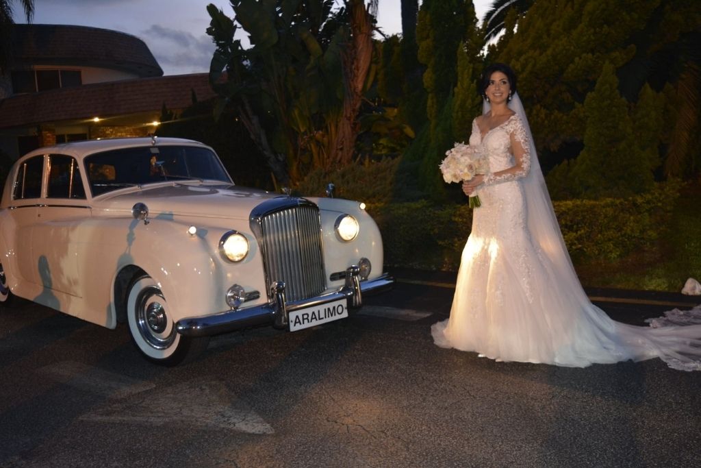 Bride Next To Classic Car | An Enchanting Miami Wedding | Real Weddings
