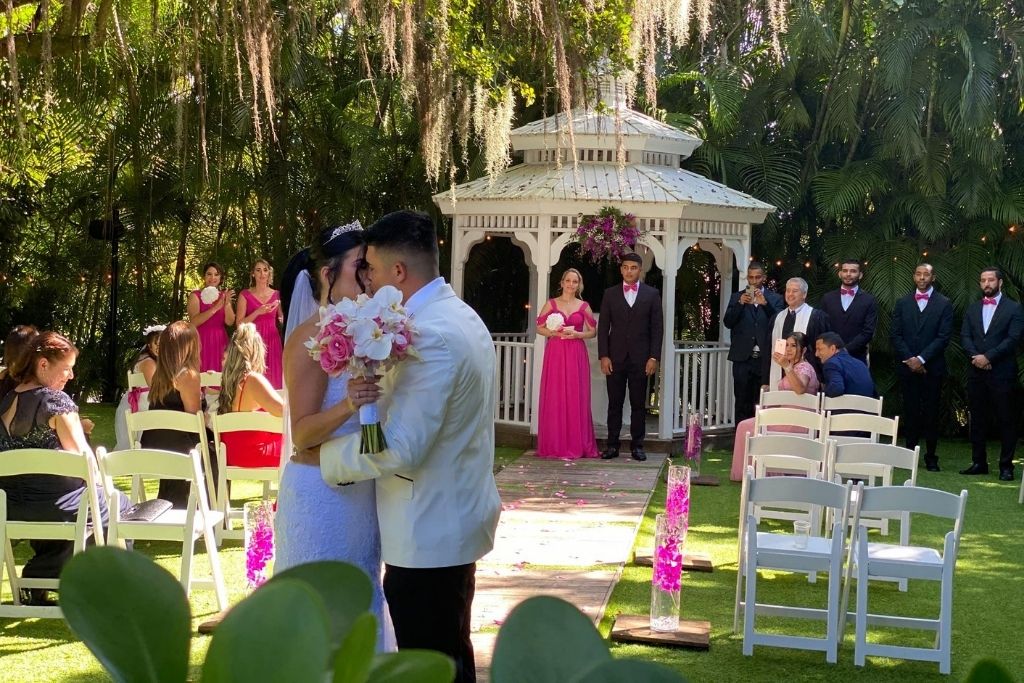 A couple kissing at their wedding ceremony