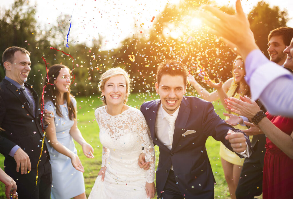 Newlyweds With Guest On Their Garden Party | 6 Benefits Of All-inclusive Wedding Packages | Blogs